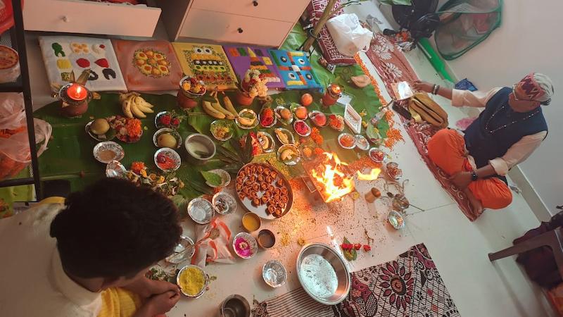 Pandit ji performing Gand Mool Nakshatra Shanti Puja with havan kund mandals and puja samagri setup at home