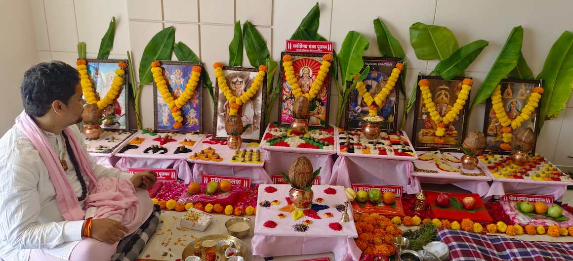 Pandit ji performing griha pravesh puja. 