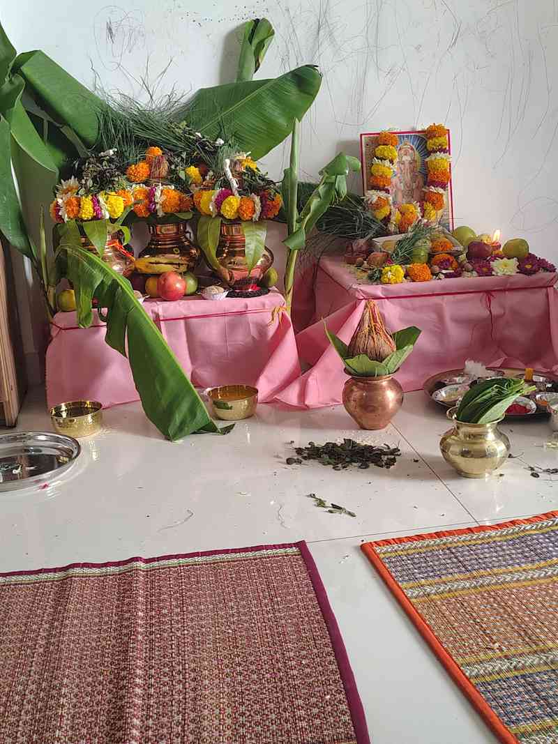 Namkaran Sanskar puja setup with kalash havan kund flowers and samagri arranged for baby naming ceremony at home in Pune